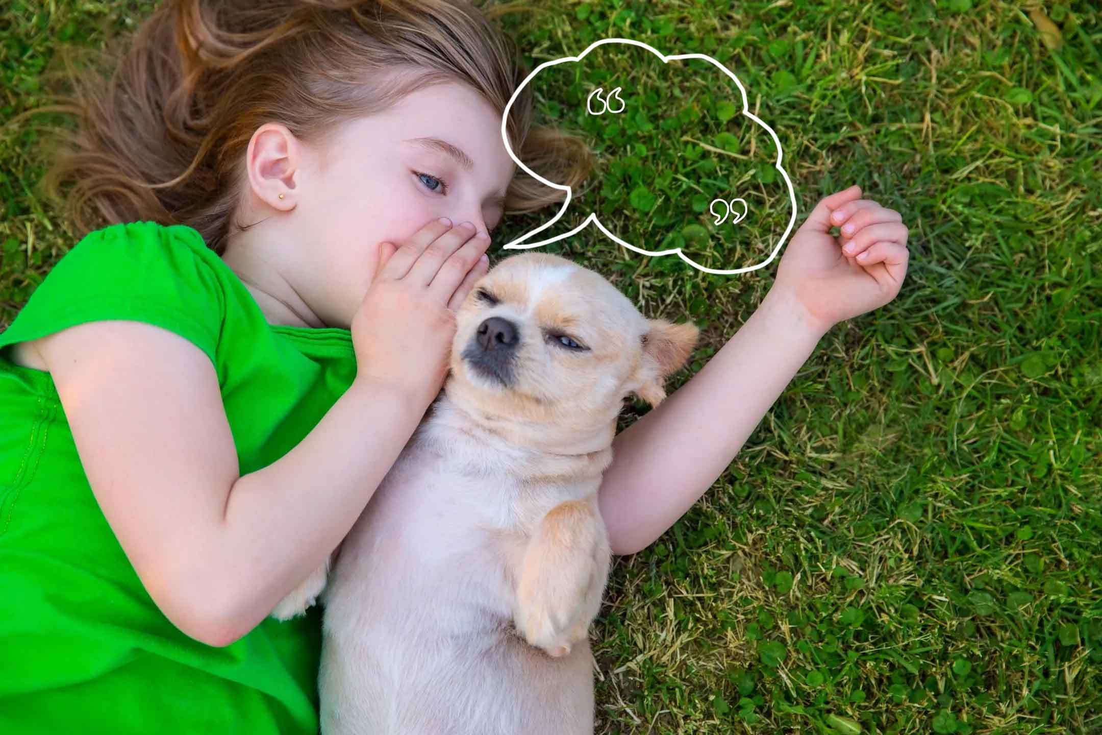 Child lying in the grass beside a dog with a speech-bubble illustration
