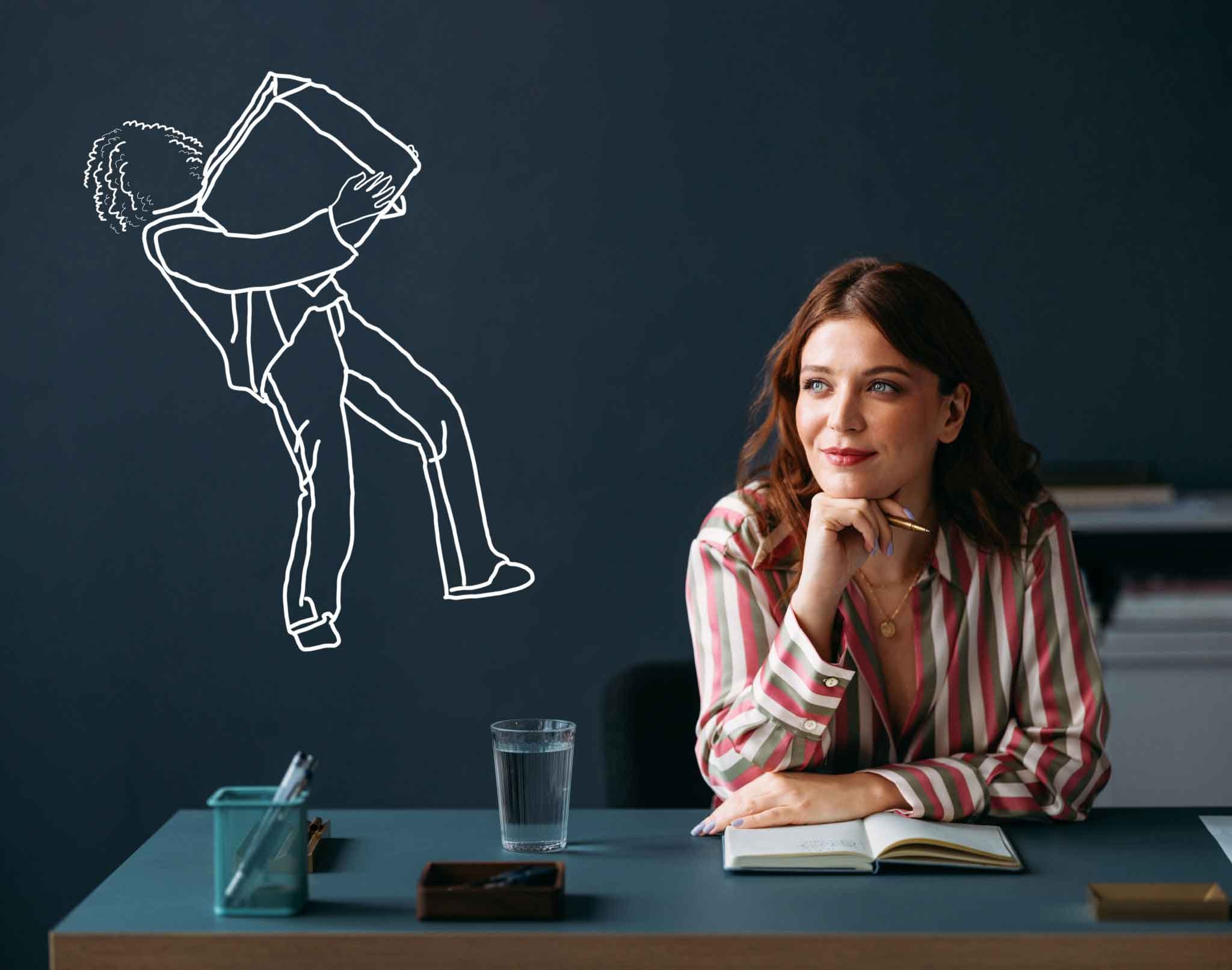 Person writing a grant proposal at a desk